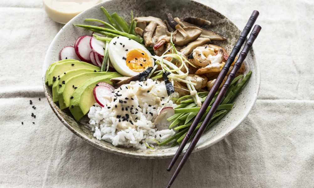 Egg and prawn served with tahini sauce photography